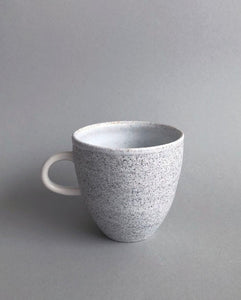 Handthrown porcelain cup with handle made with volcanic ash